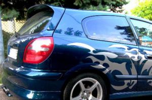 Spoiler above the rear glass, extended.